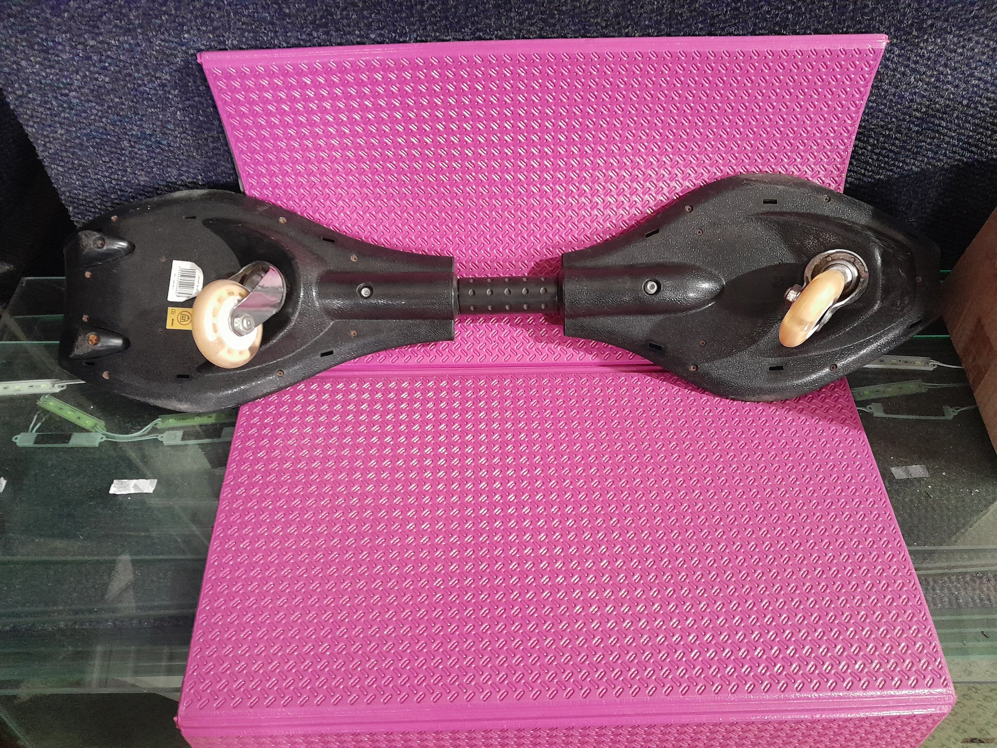 Close-up of a Surge Caster Board, showcasing its unique design and flexibility for riders.