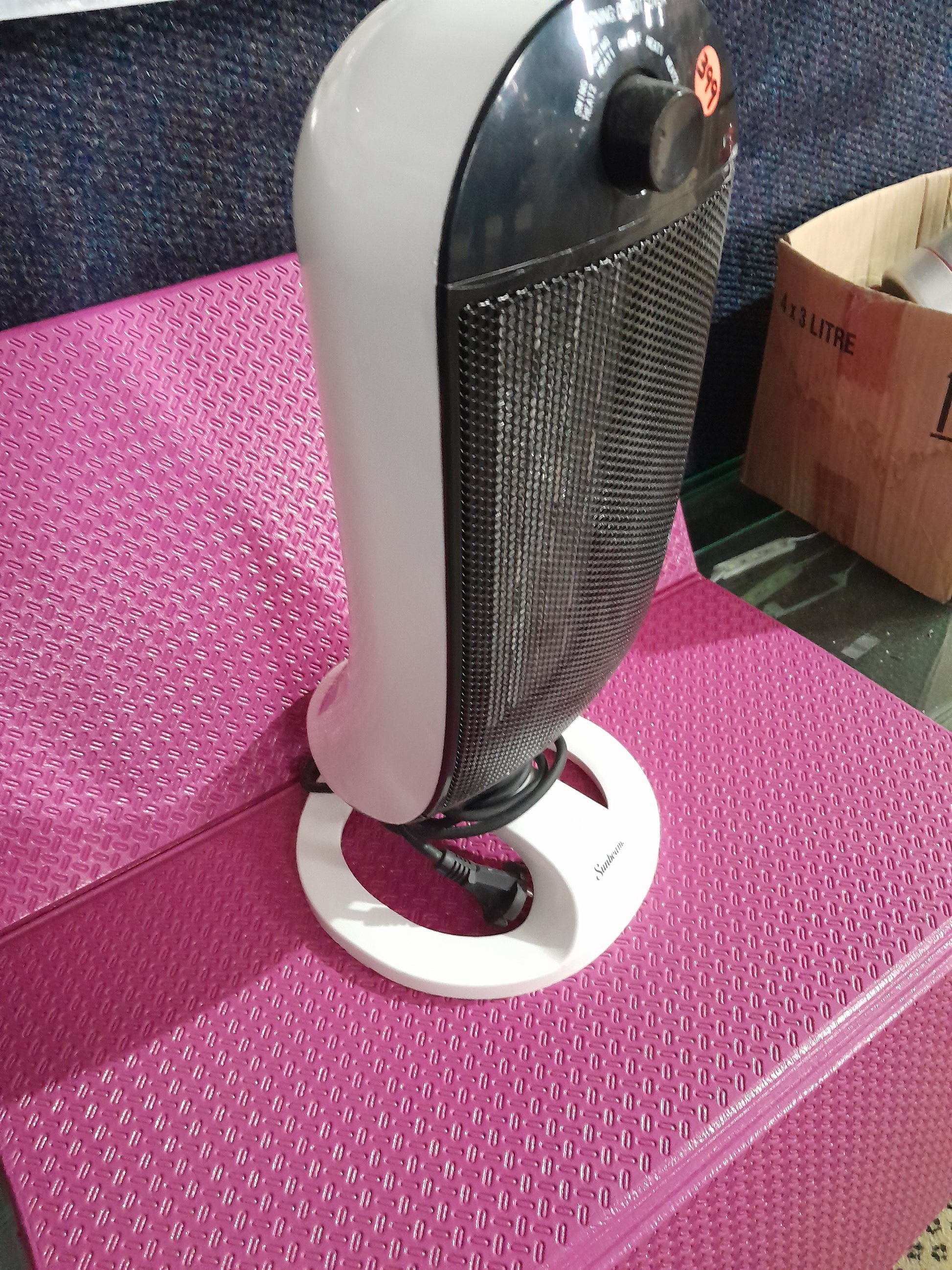 Portable Sunbeam PTC heater designed for even heat distribution in small spaces.