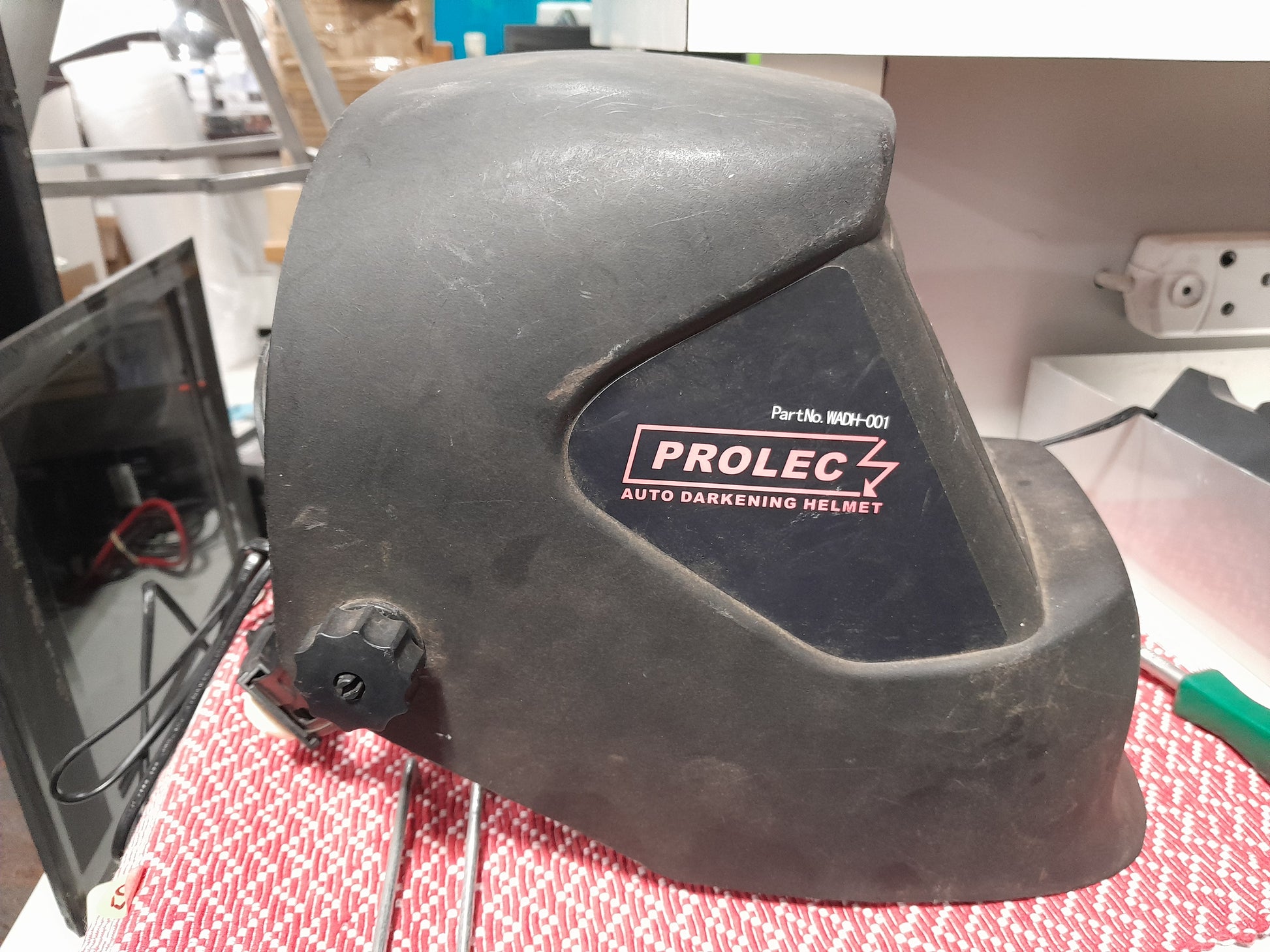 Prolec welding helmet displayed in secondhand store, ideal for welding safety and protection.