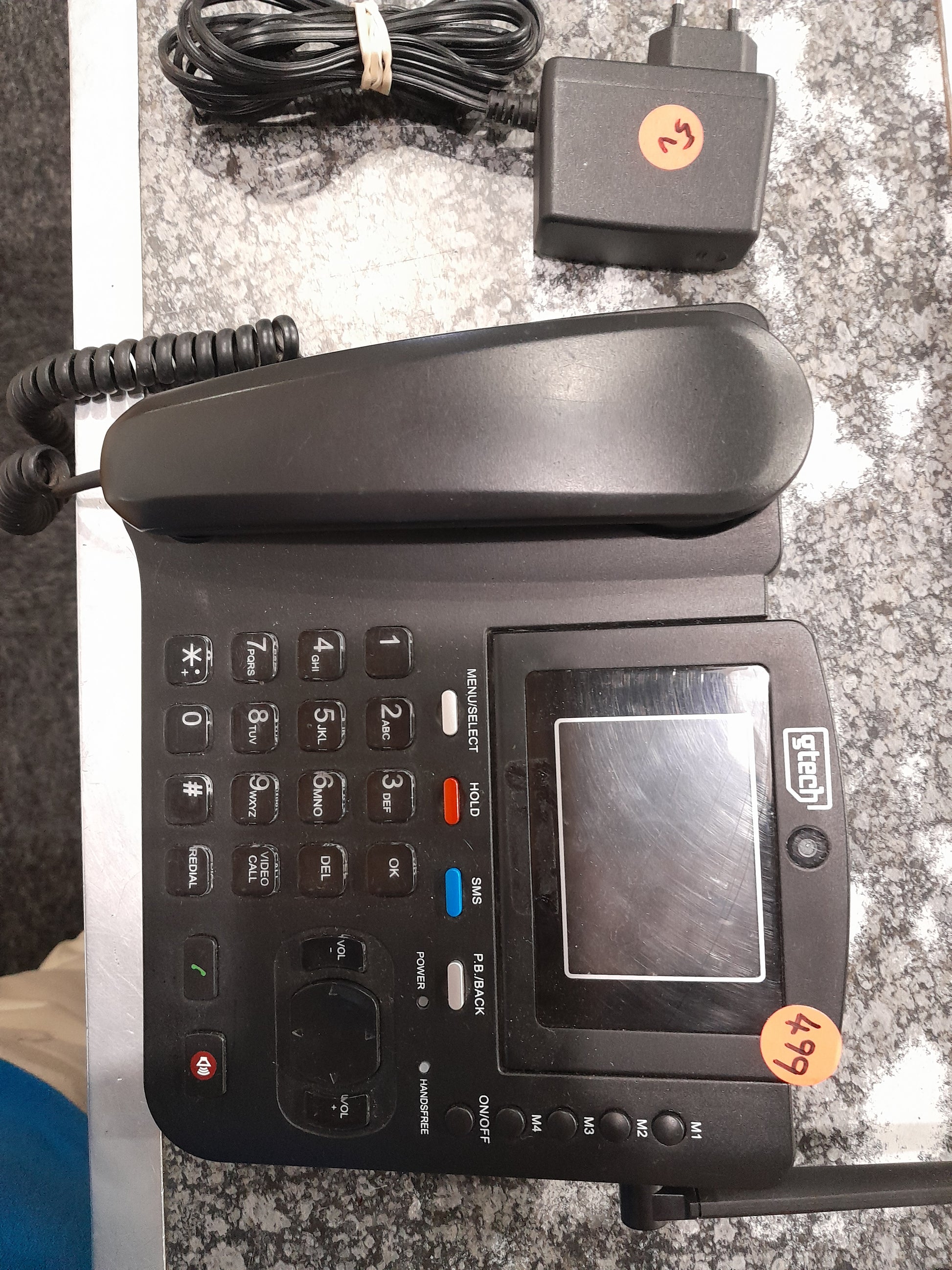 G-Tech 4G fixed wireless phone with power adapter, suitable for any workspace.
