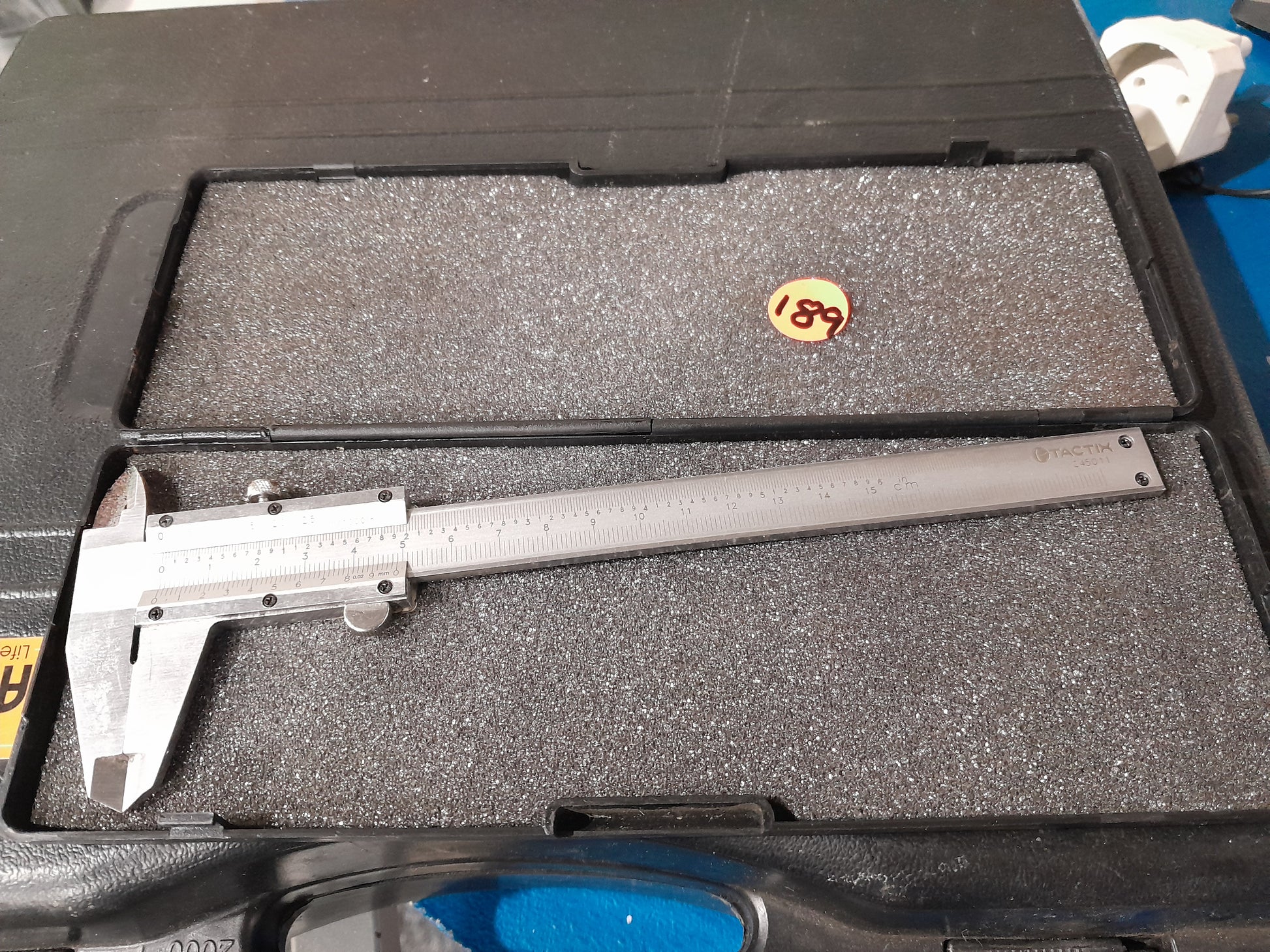 Tactix Vernier Caliper shown in a protective case, ideal for precise measurements.