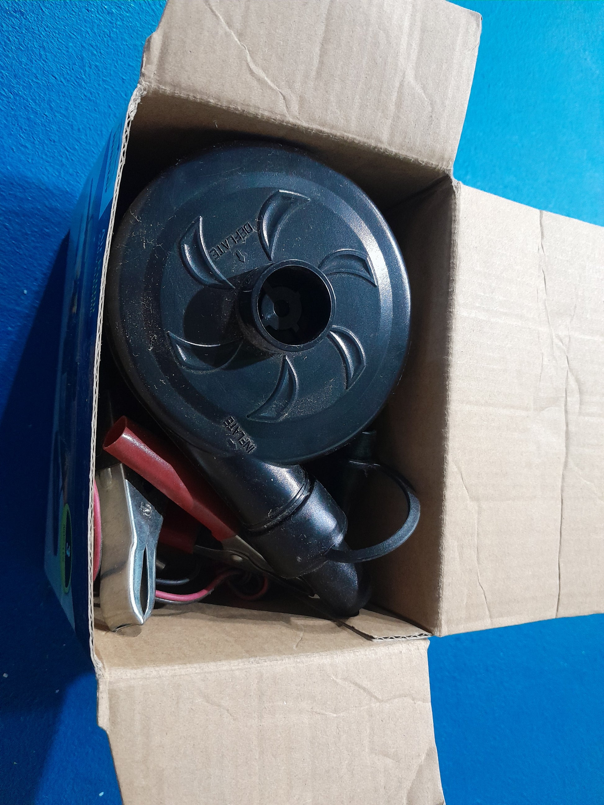 Detailed view of Camp Master air pump box, showing high capacity flow and usage instructions.