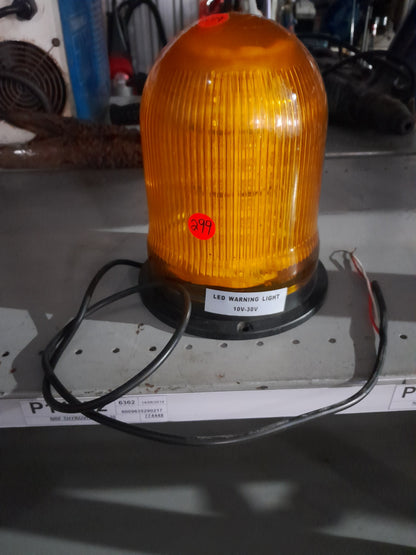 High-visibility orange LED warning light, commonly used in emergency and safety applications.