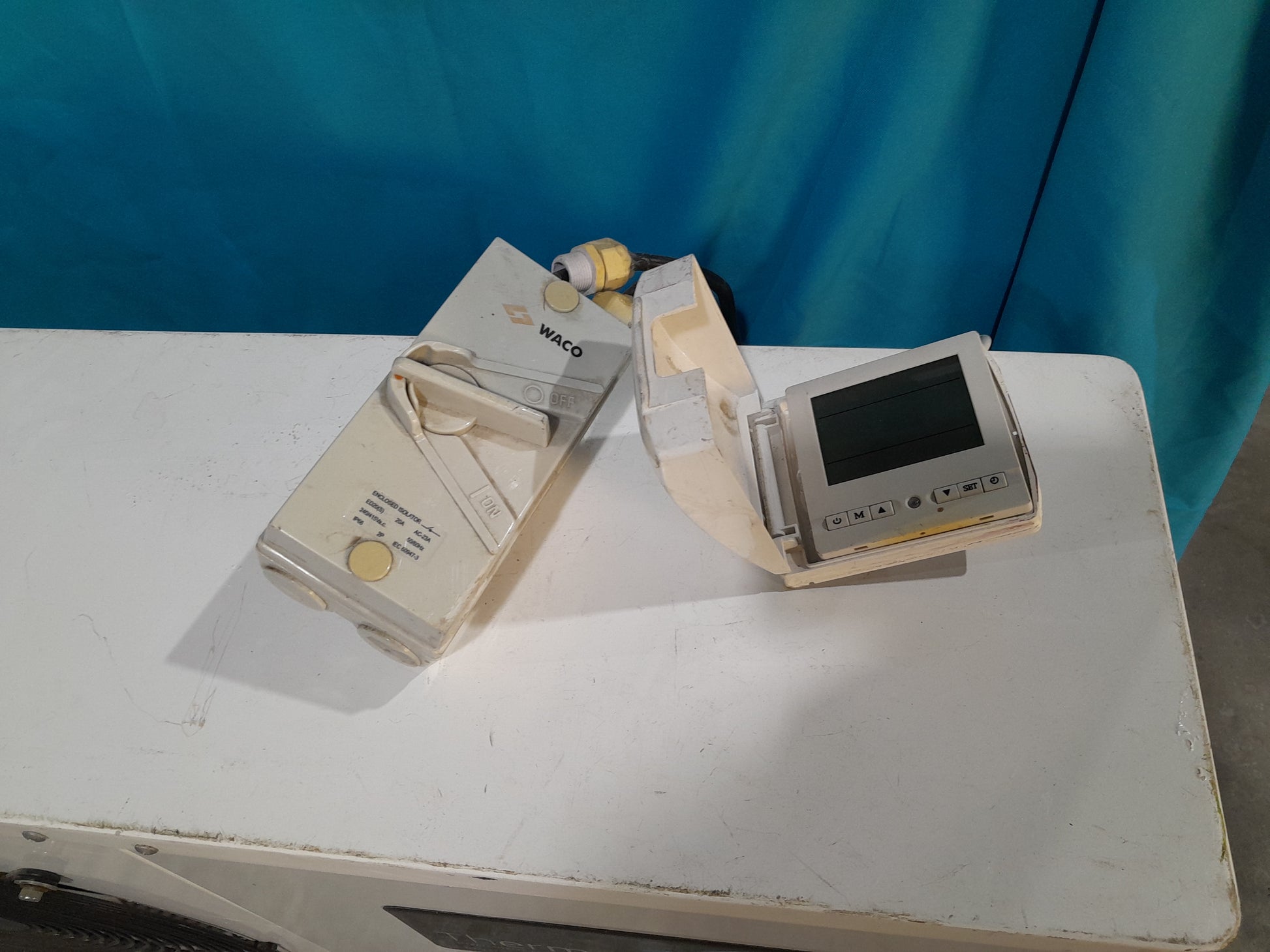 ThermoWise control units on display, featuring measurement and technical functions for water heating systems.
