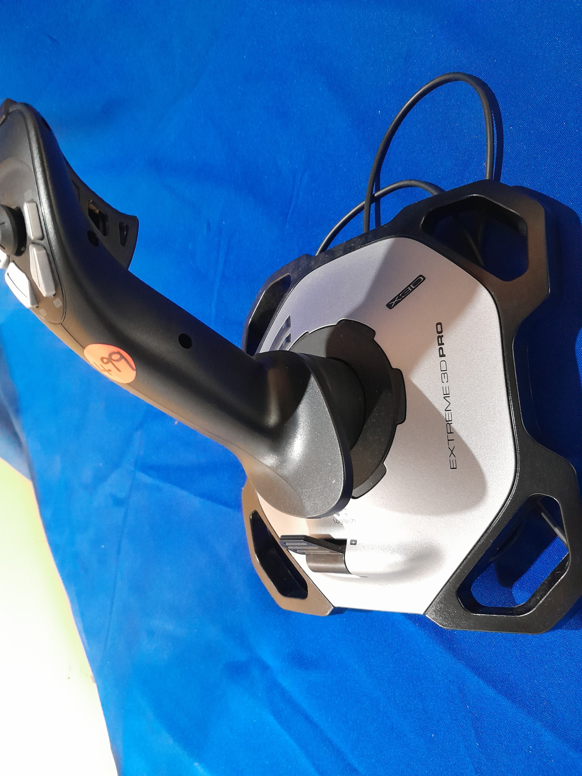 Logitech Extreme 3D Pro joystick with buttons and throttle control, ideal for flight simulations.