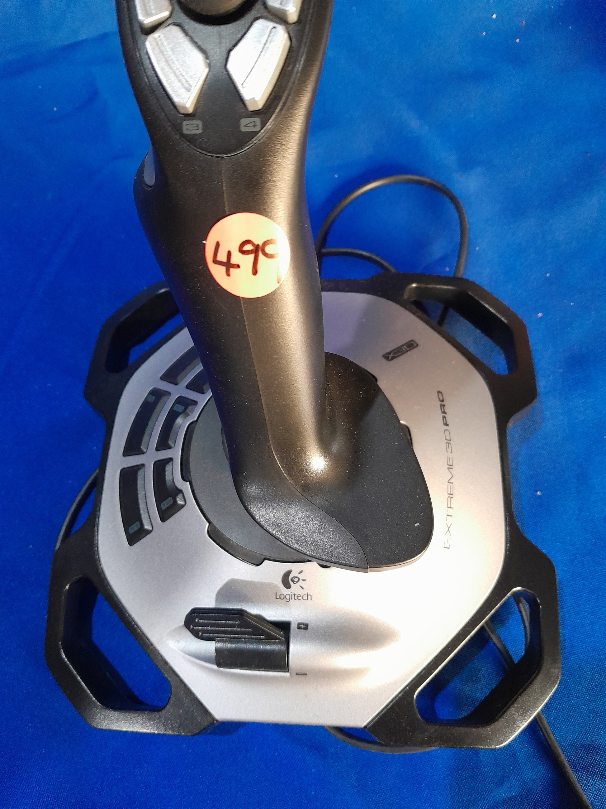 Logitech Extreme 3D Pro joystick with programmable buttons, ergonomic grip, and price tag, ideal for flight simulators.
