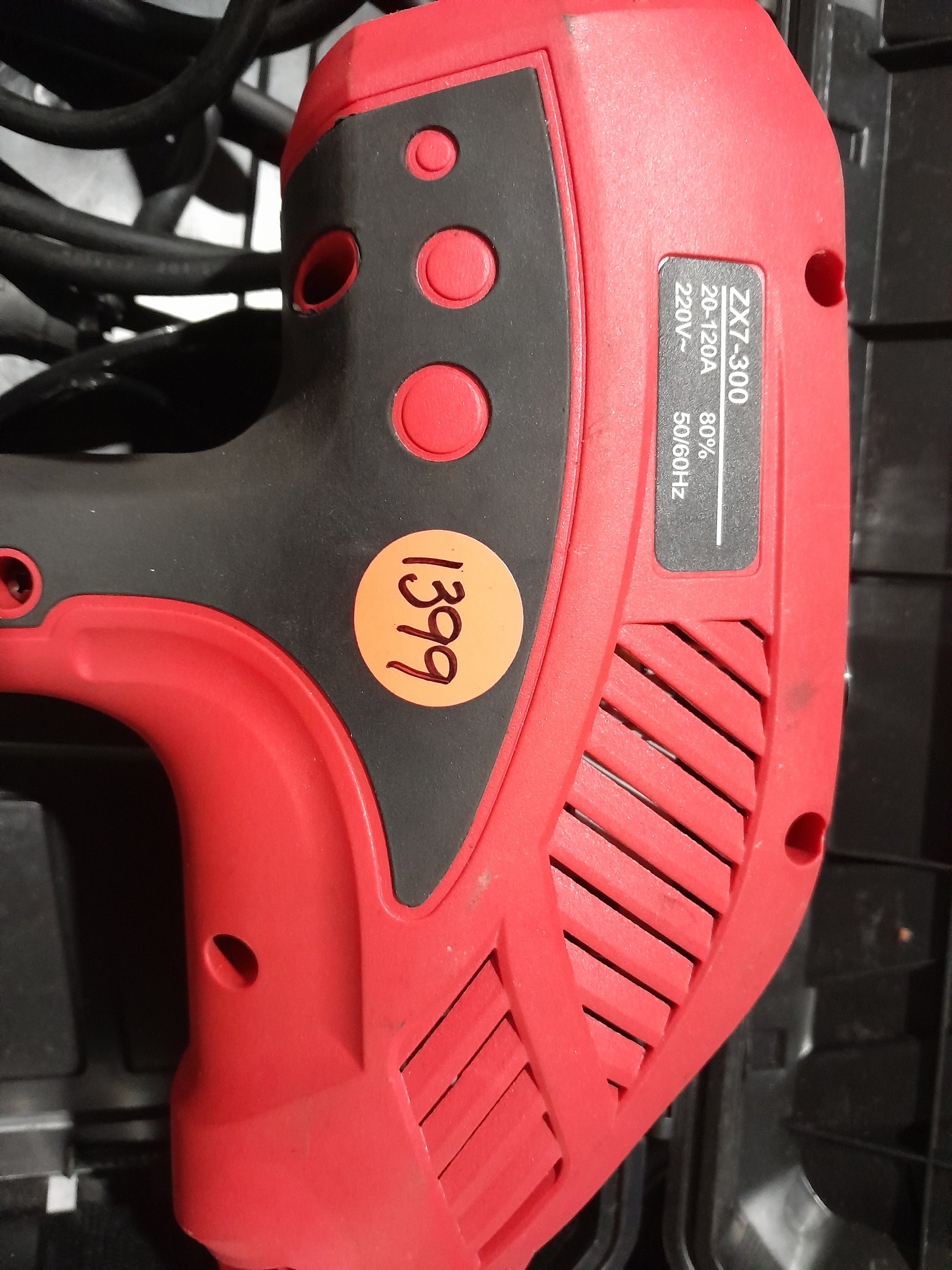 ETop ZX7-300 handheld welding machine with compact design, 20-120A current range, and visible model specifications.