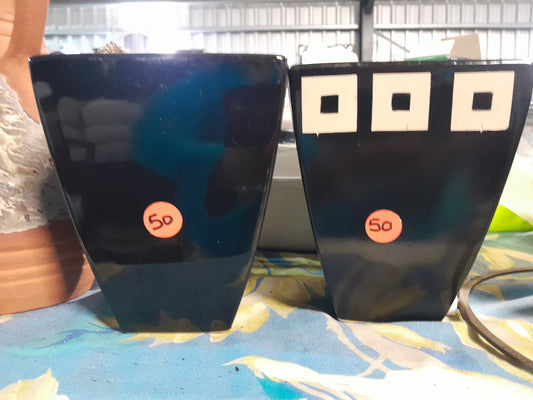 Two dark brown flower vases with subtle texture, labeled with price tags, perfect for small plants or floral arrangements.