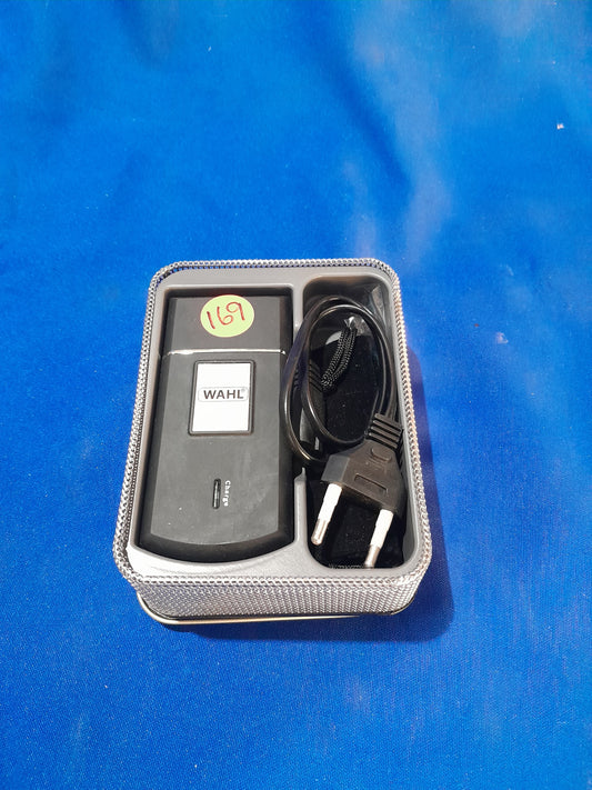Wahl Travel Shaver with cordless design and silver carry case, lightweight and compact for efficient grooming on-the-go.