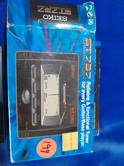 Packaging of Seiko ST737 guitar and bass tuner, ideal for guitarists and bassists seeking precision tuning.