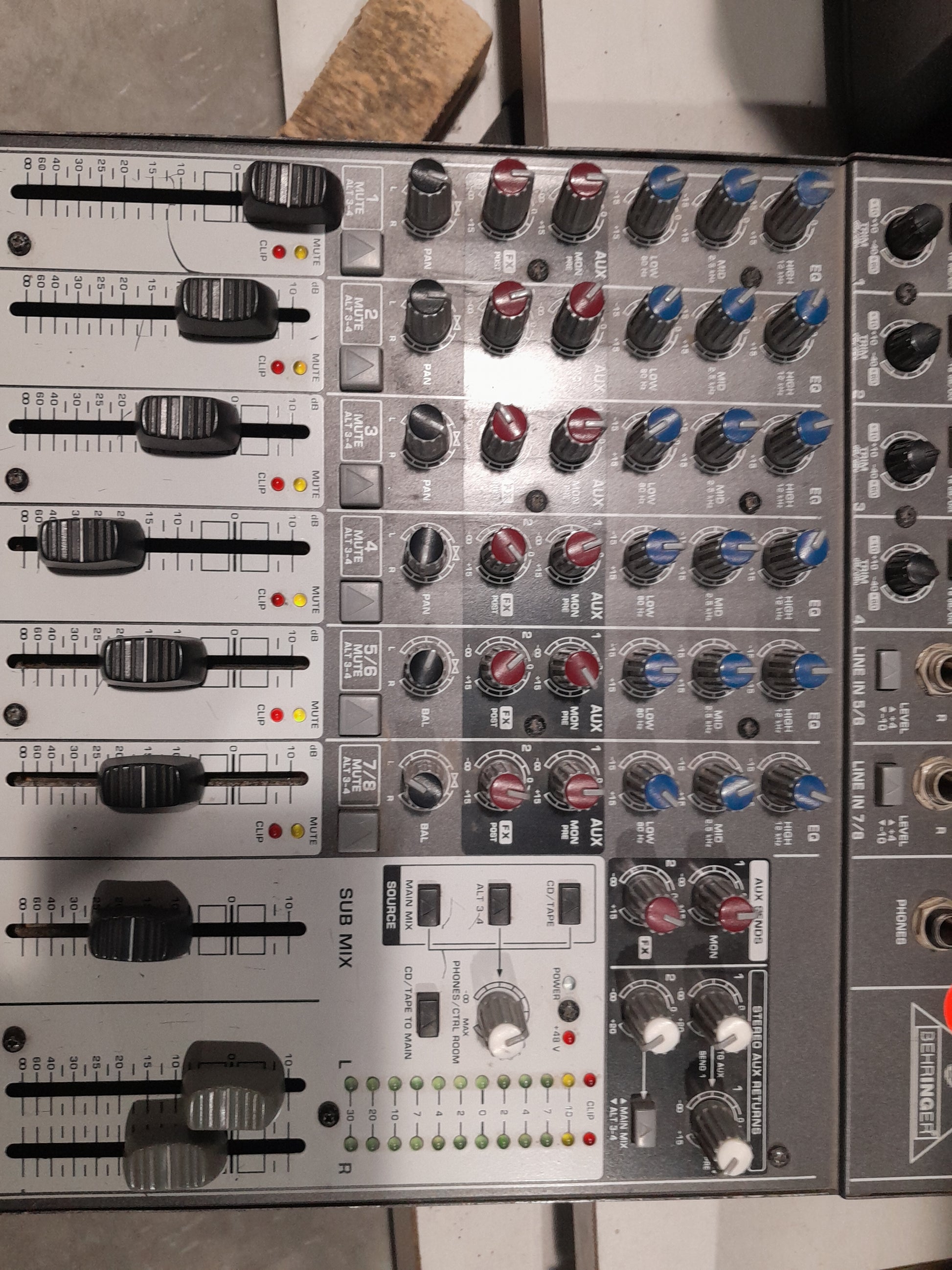 Behringer Xenyx 1204 USB audio mixing console with multiple input options.