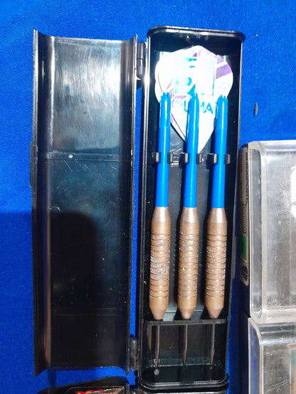 Five stylish dart sets, complete with flights and protective cases, perfect for any game room.