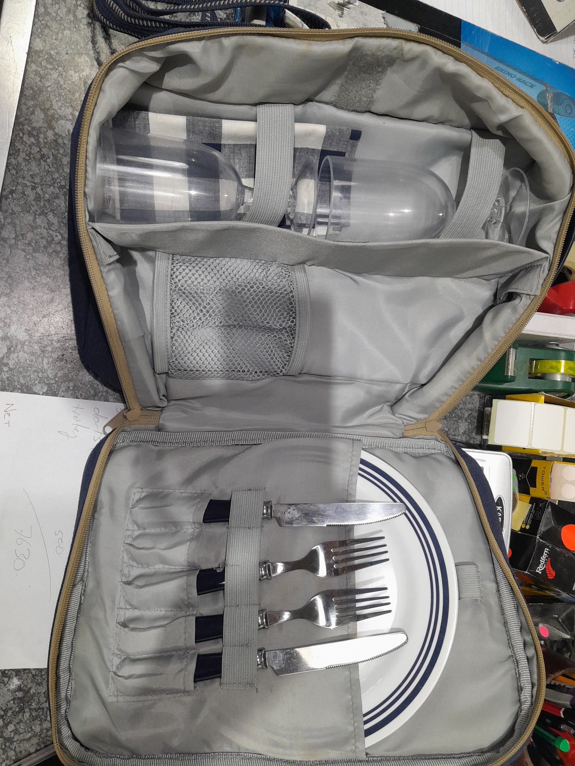 Compact picnic set for two, including utensils, plates, and glasses in a convenient carry bag.