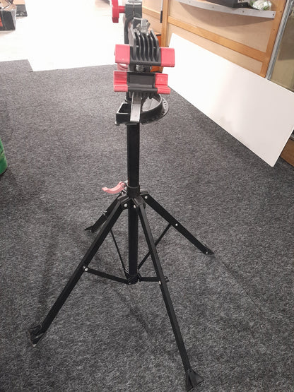 Compact and portable Tork Craft bicycle repair stand, essential for every bike enthusiast's home workshop.