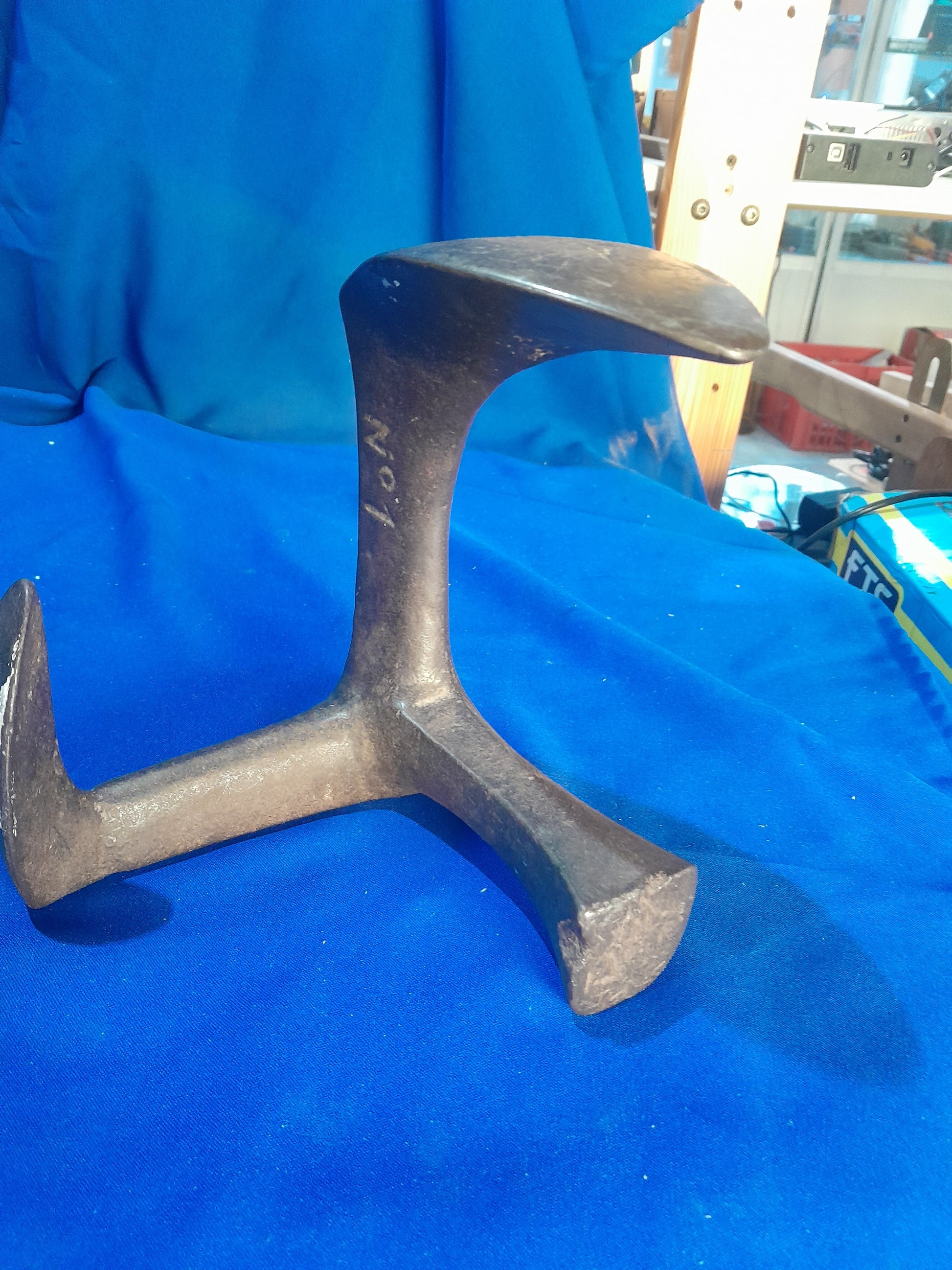 Durable cast iron shoe last used in cobbling, perfect for shoe repair enthusiasts and artisans.