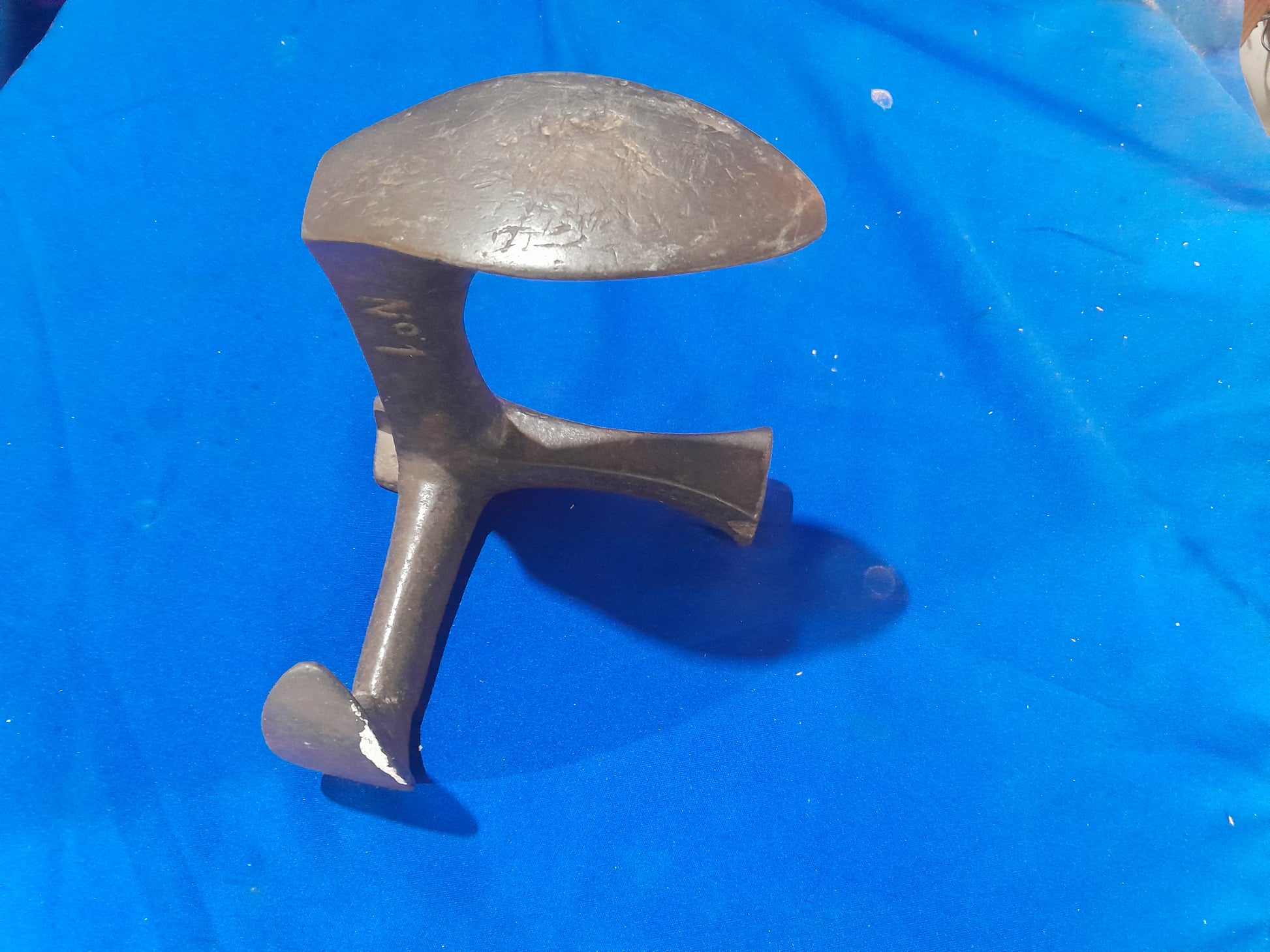 Classic cobbler's shoe last in cast iron, a must-have tool for shoe making and repair projects.