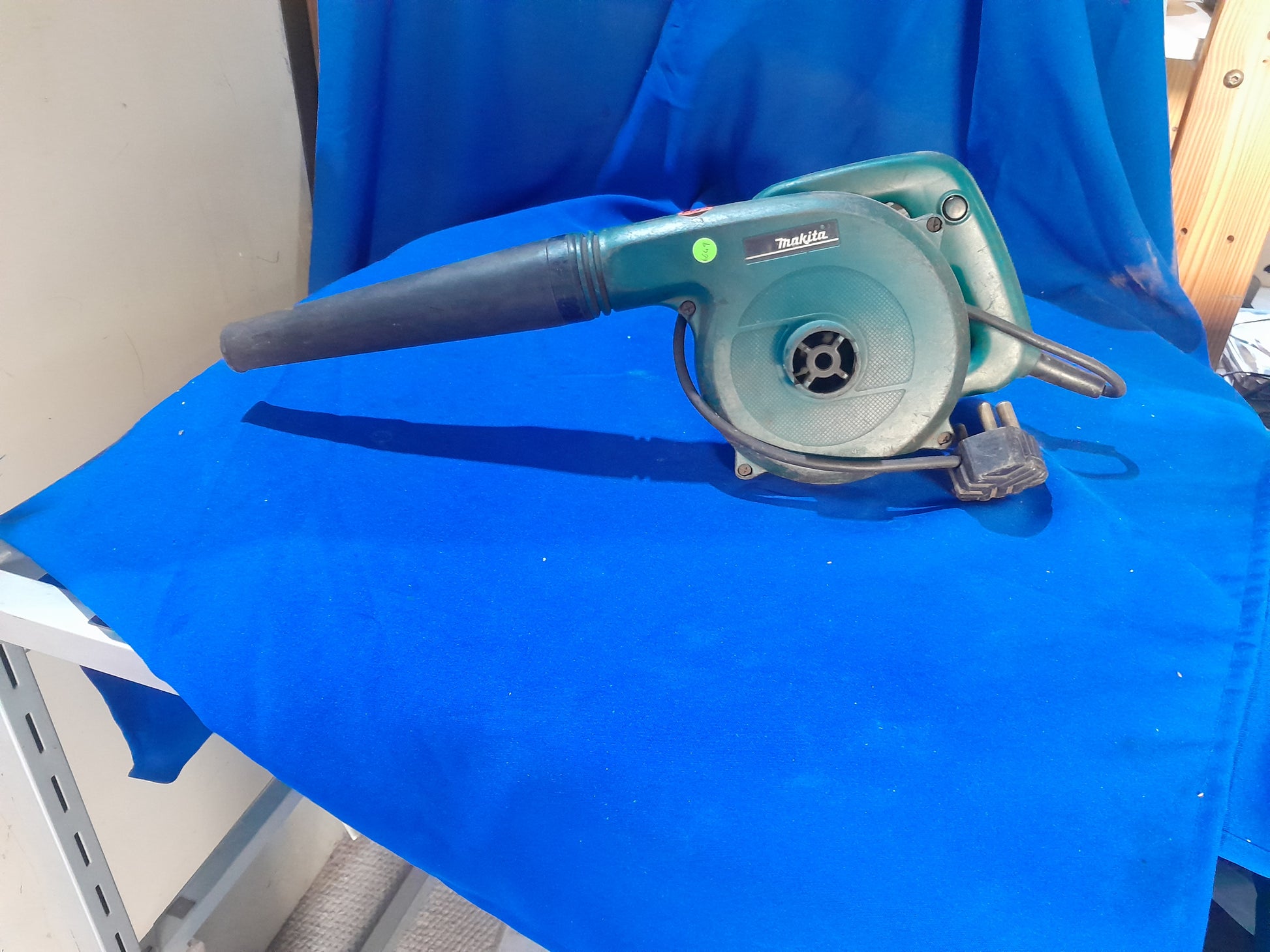 Reliable Makita leaf blower, great for maintaining clean driveways and patios by blowing away debris.