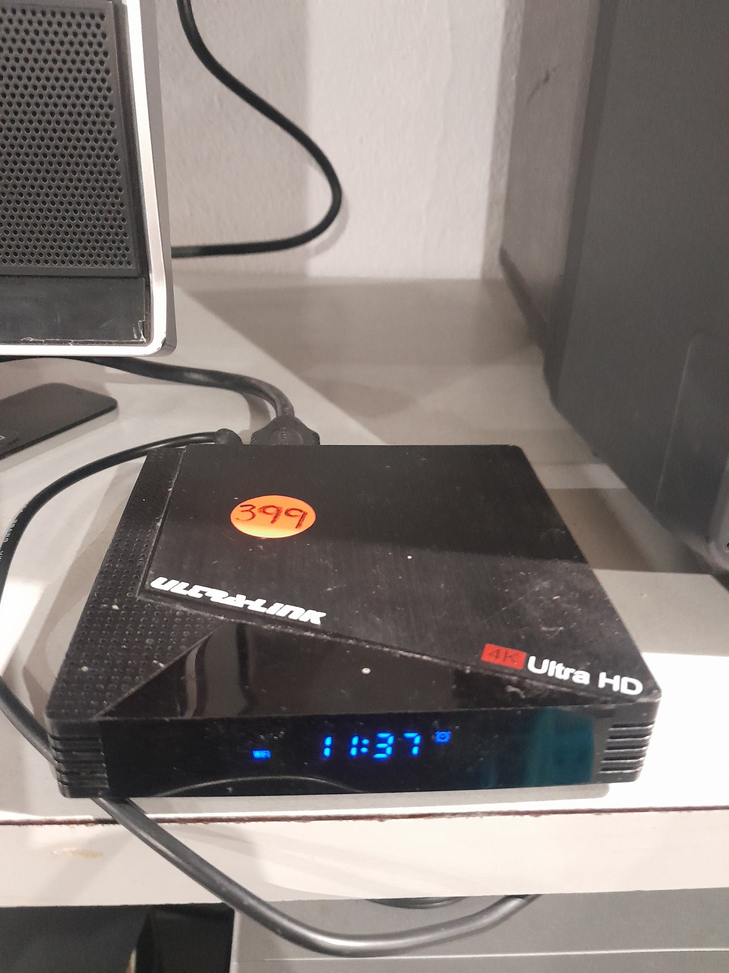 Ultra Link 4K Android TV Box with USB ports and time display, ideal for streaming.