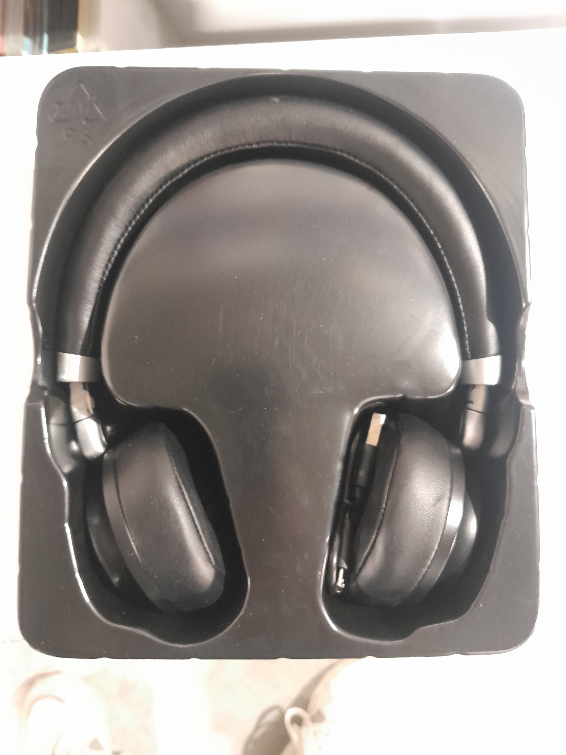 Box of Shenzhen Bluetooth Headset Model H-001 showcasing sleek design and packaging.
