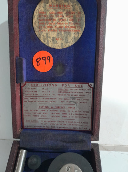 Detailed view of vintage hand tachometer components, perfect for collectors and mechanics.