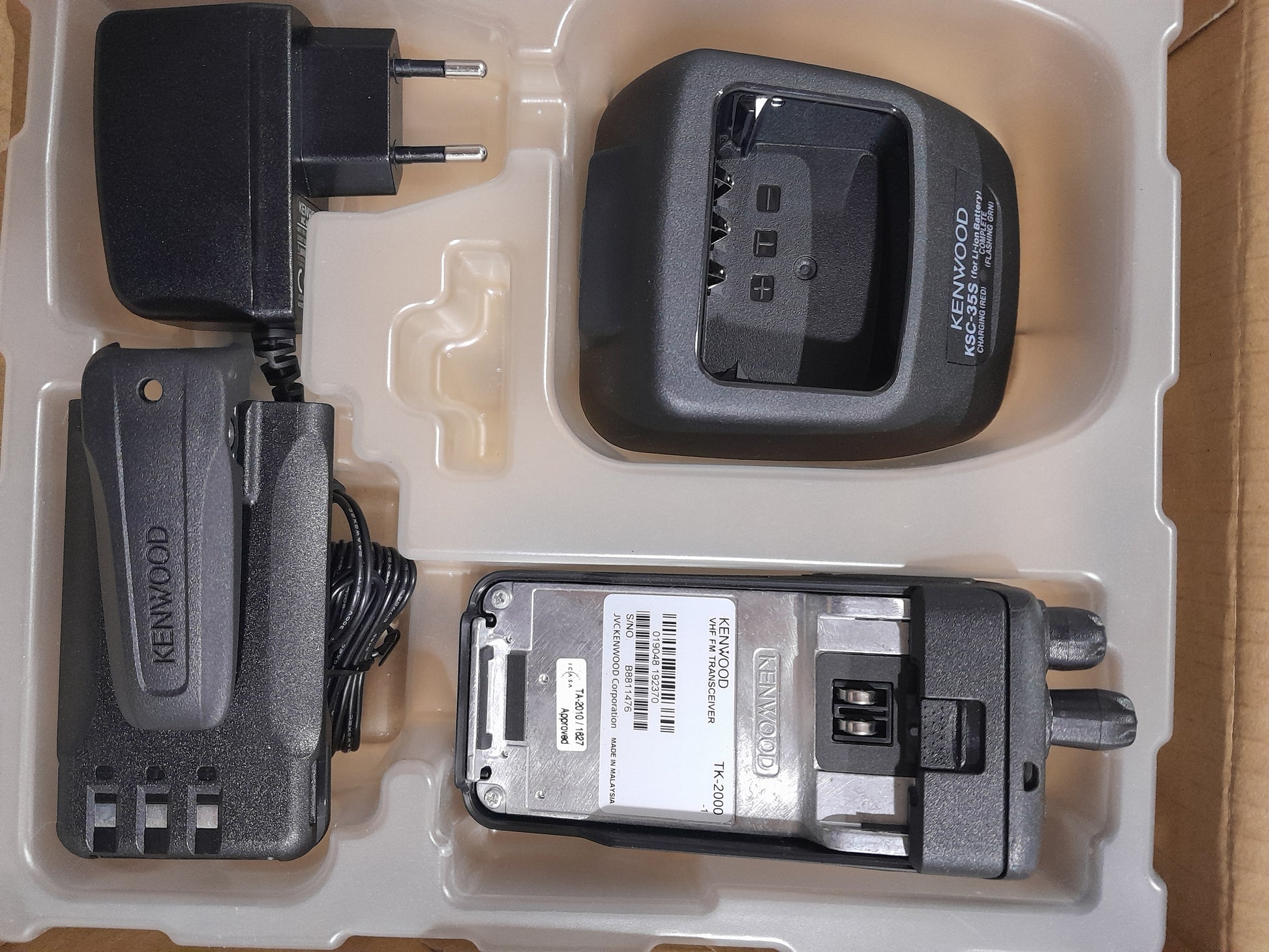 Kenwood TK-2000 radio in box with charger, perfect for users needing a dependable two-way communication device.