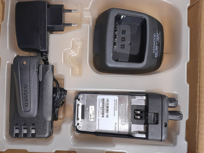 Kenwood TK-2000 radio in box with charger, perfect for users needing a dependable two-way communication device.