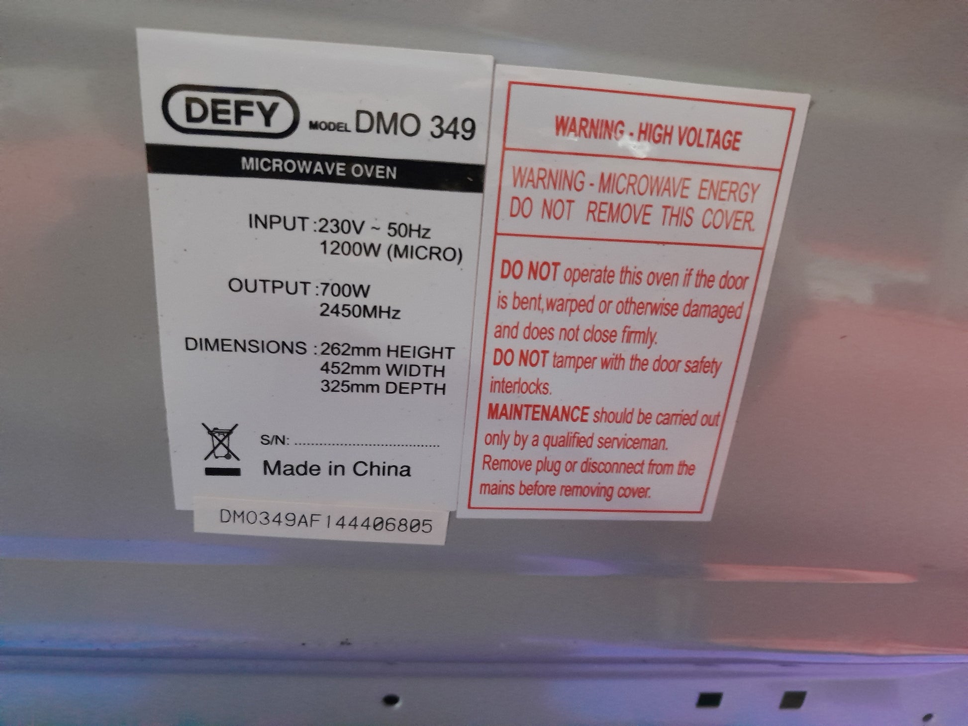 Defy kitchen microwave with 20L capacity and mirror glass door, 700W, perfect for reheating meals.