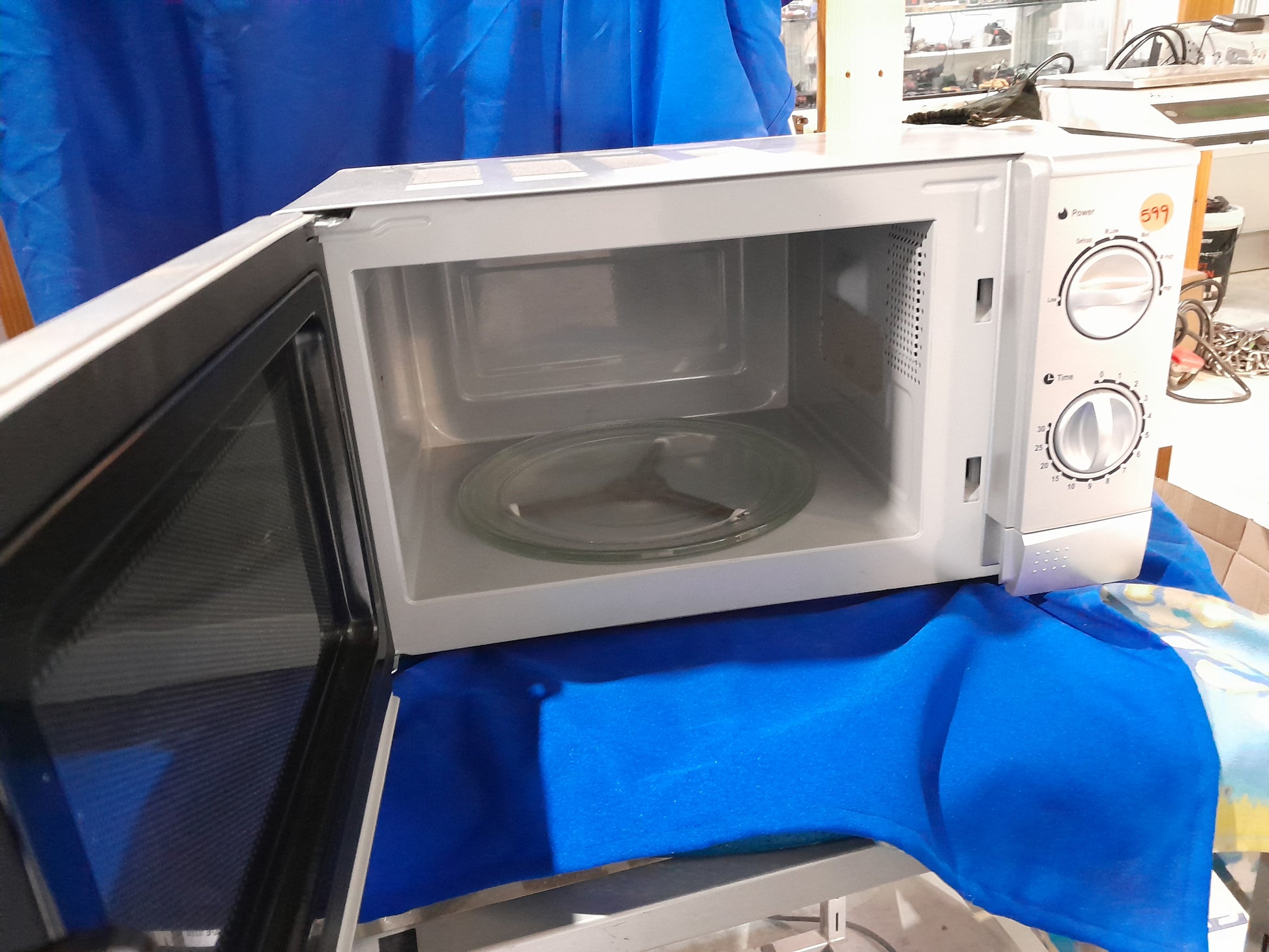Silver mirror glass door microwave by Defy, model DMO 381, 700W, suitable for various kitchen needs.
