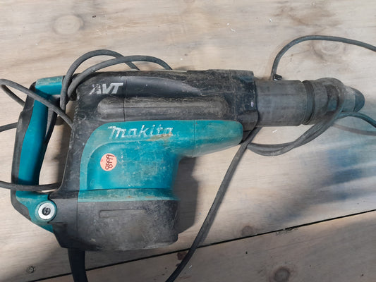 Secondhand Makita HR5211C demolition hammer, perfect for construction and renovation projects.