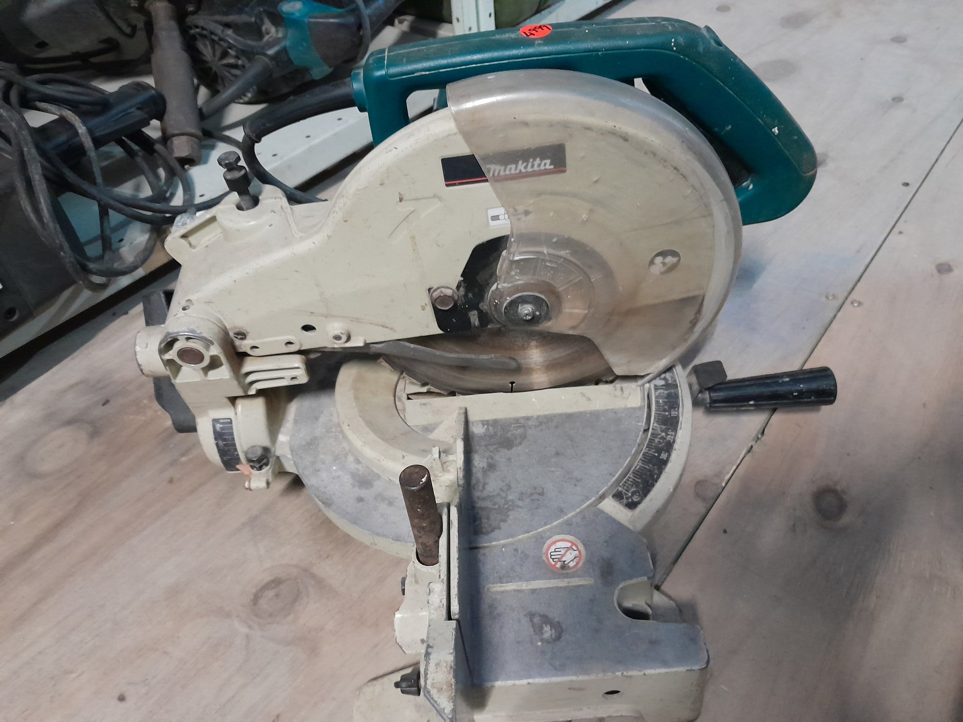 Makita LS1040 compound mitre saw from above, ideal for precise crosscut and miter cuts in wood.