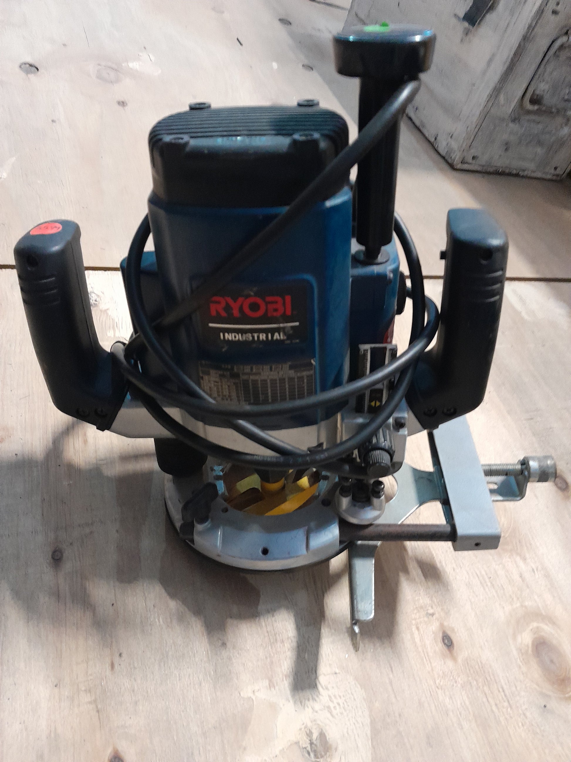 Front angle of a Ryobi Industrial Router with a 2050W motor and plunge action.