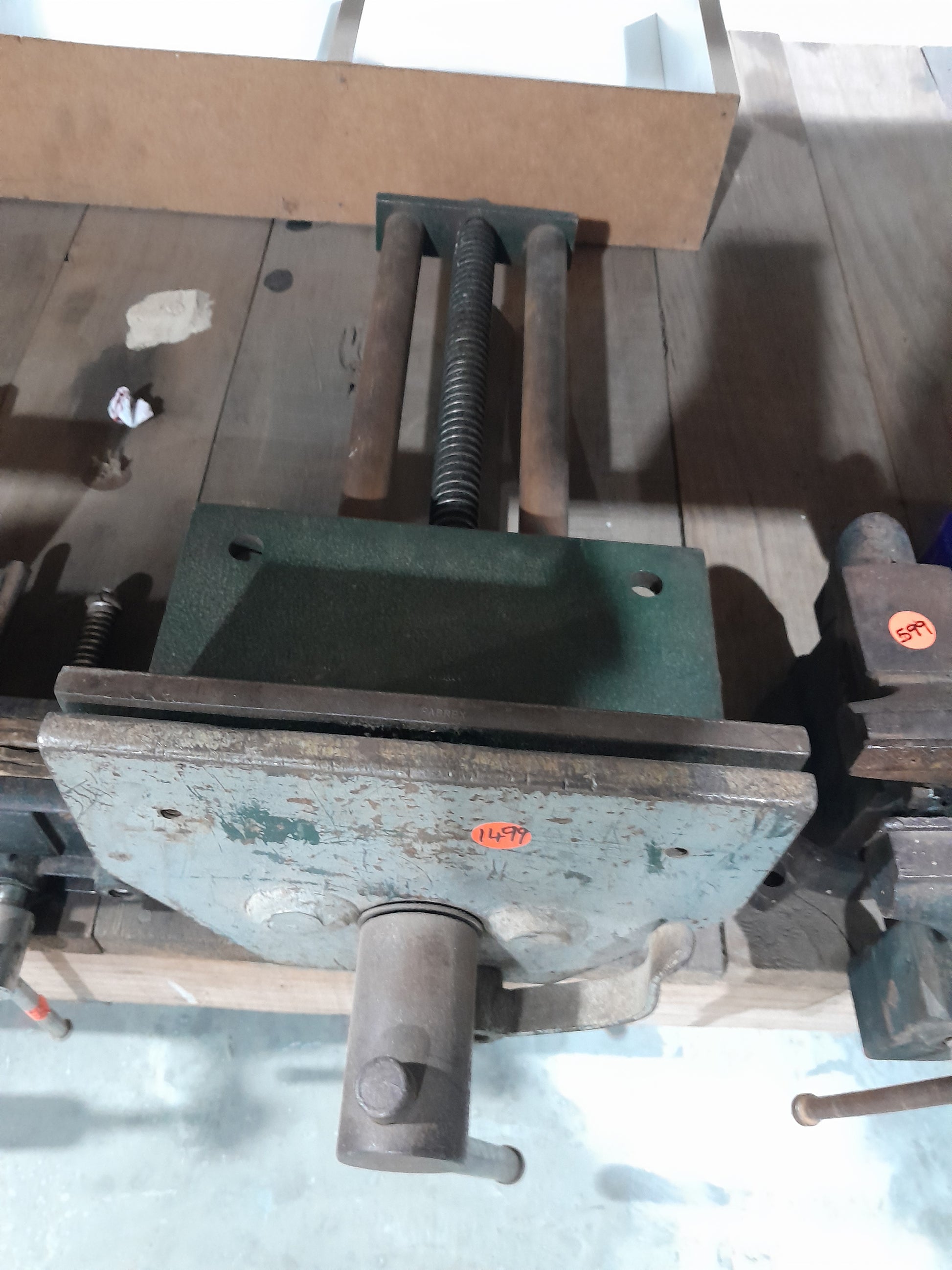 Detailed view of a woodworking vise, highlighting its durable construction for effective material holding.