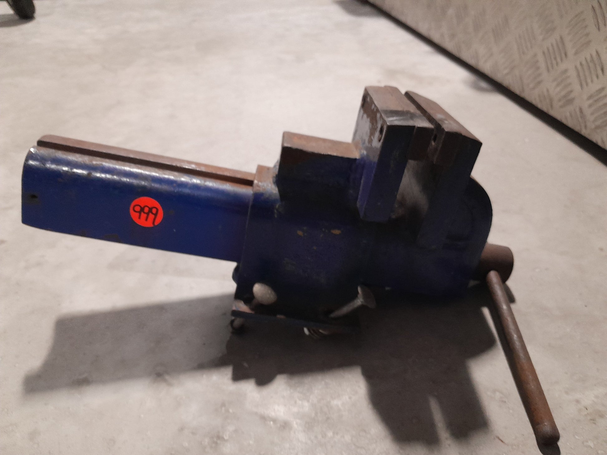Heavy-duty bench vise designed to hold materials securely while you work on various projects.