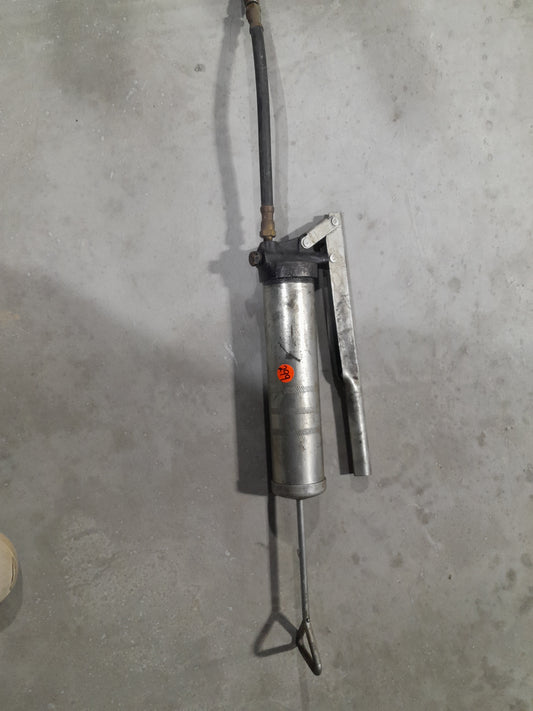 A lever action grease gun designed for general lubrication and maintenance tasks.