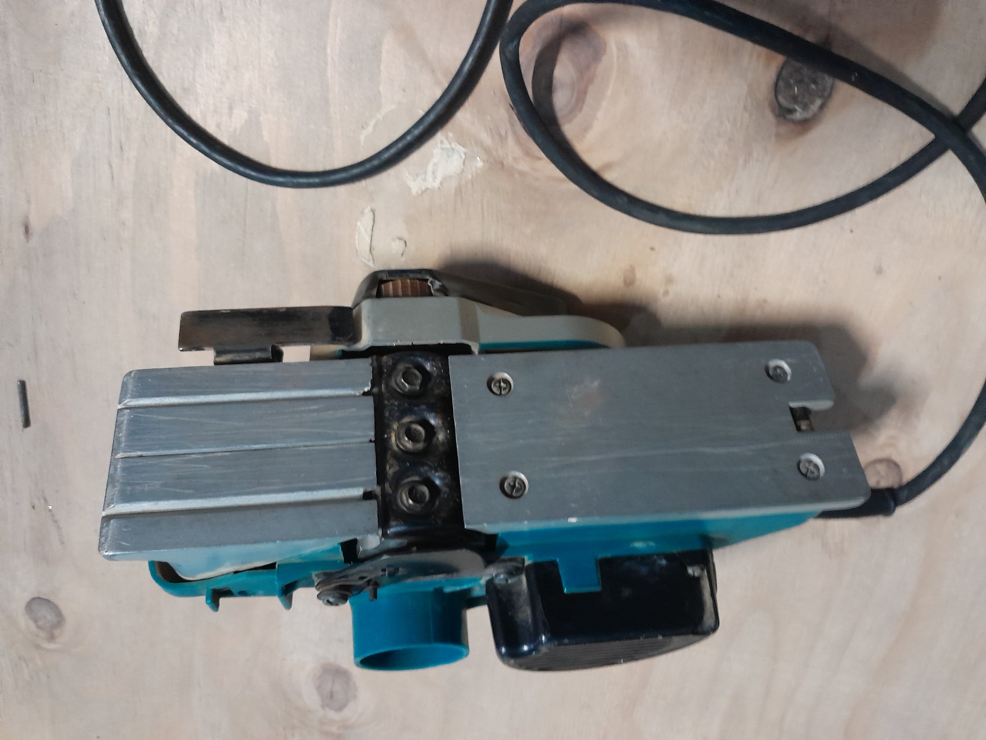 Detailed shot of Makita KP0810K planer, featuring adjustable depth settings.