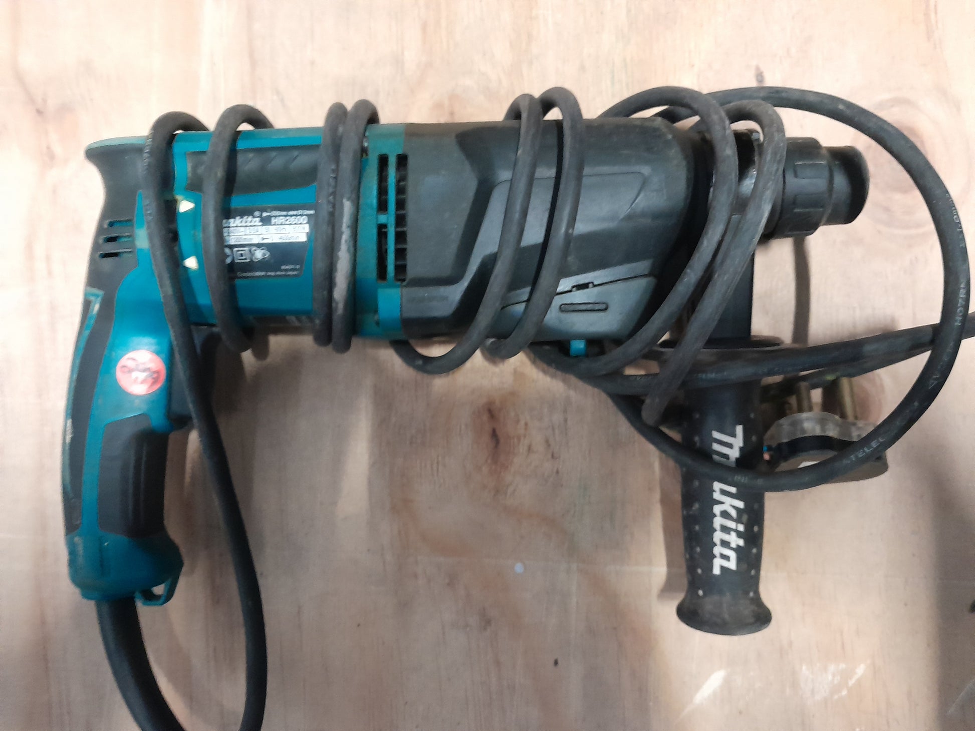 Complete view of Makita HR2600 rotary hammer drill ready for various drilling tasks.