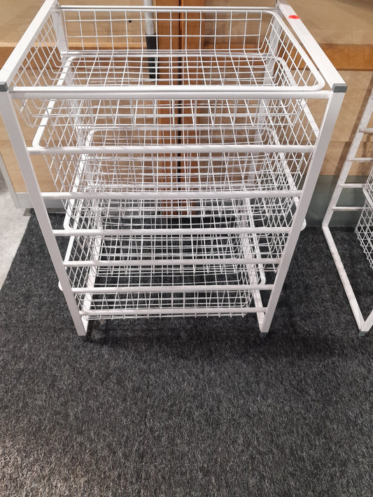 Ikea Jonaxel storage system with four sliding drawers for versatile organization.
