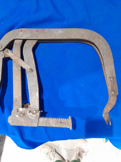 Durable valve spring compressor ideal for automotive engine repairs and maintenance tasks.