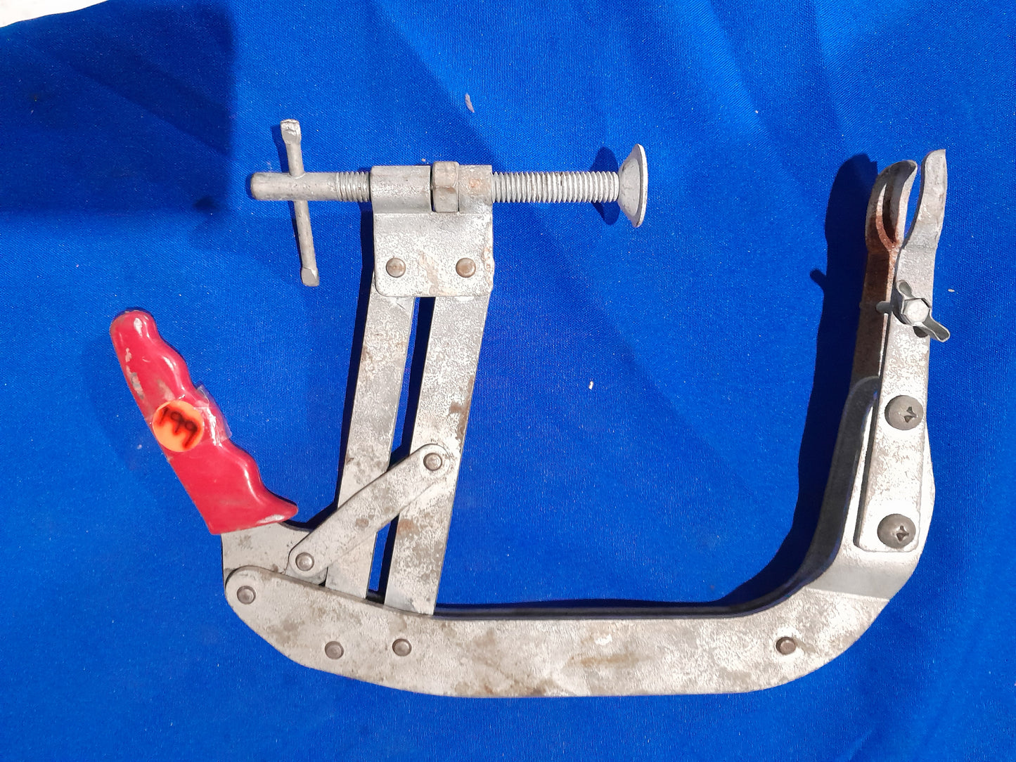 Used USAG valve lifter clamp, perfect for engine maintenance and valve spring installation.