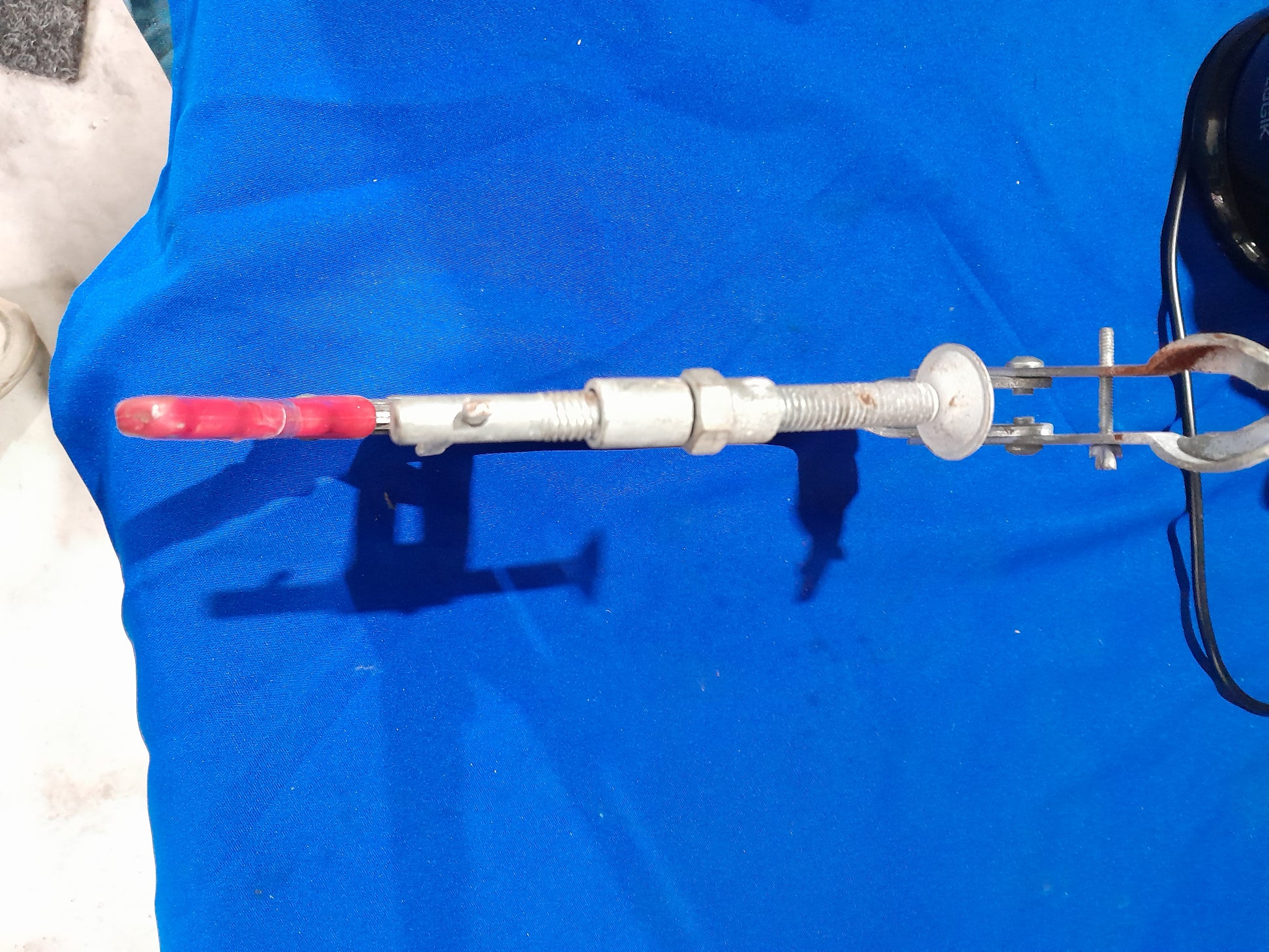 Durable USAG valve lifter clamp, designed for easy valve spring removal and installation in engines.