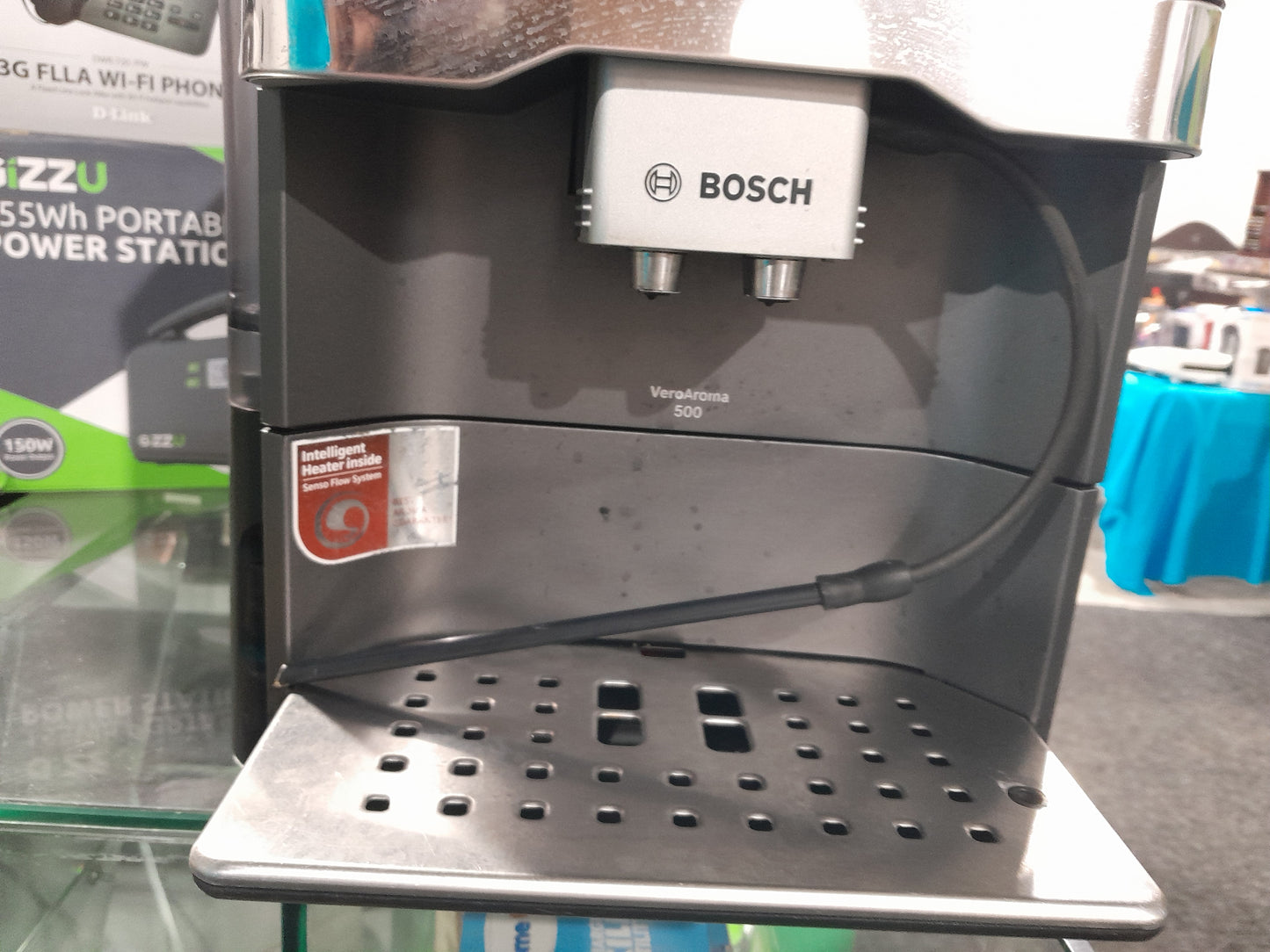 Bosch VeroAroma 500 coffee machine displayed in a secondhand store with other appliances.
