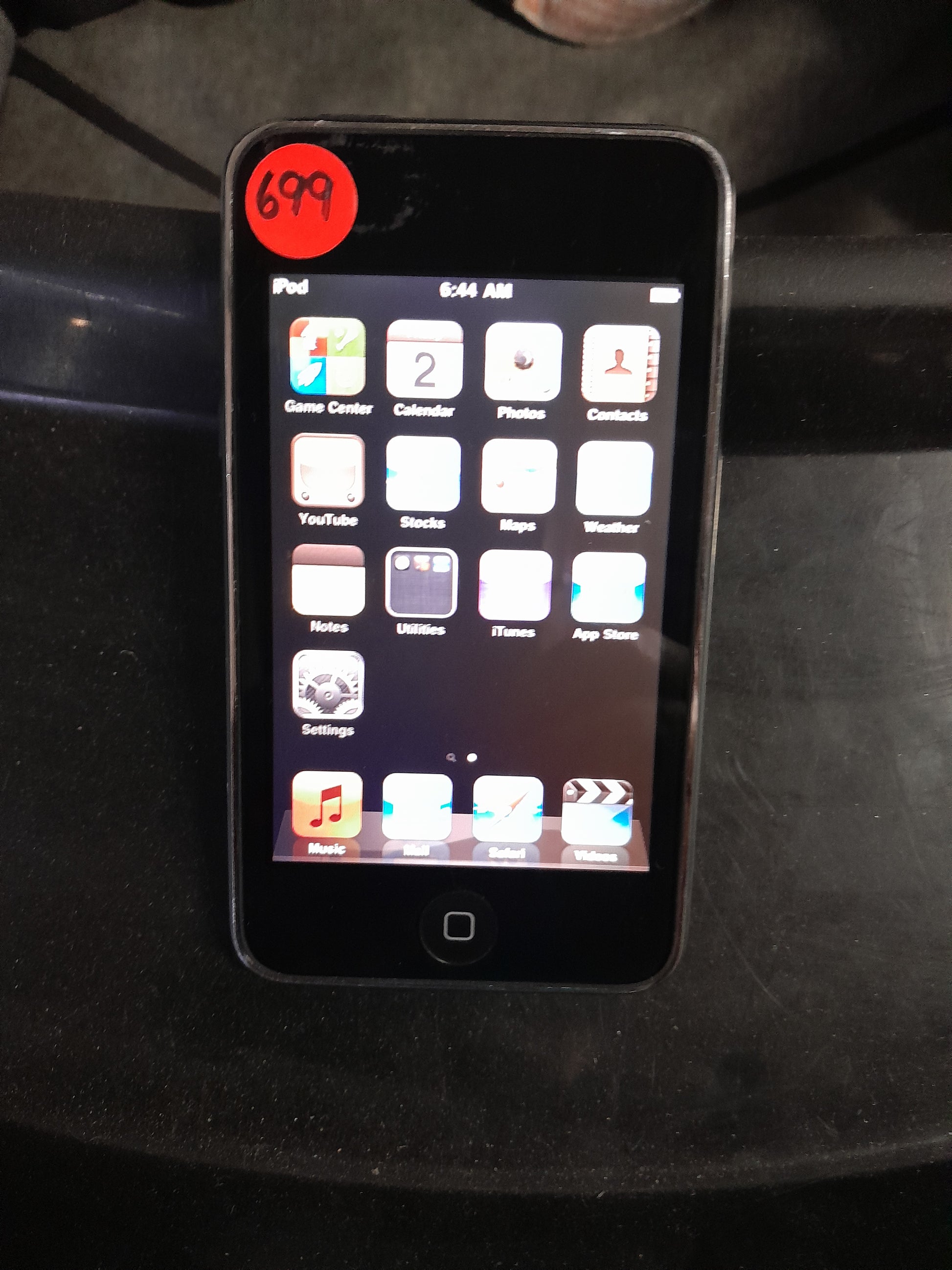 Apple iPod Touch 8GB media player with multi-touch screen, ideal for music and videos.