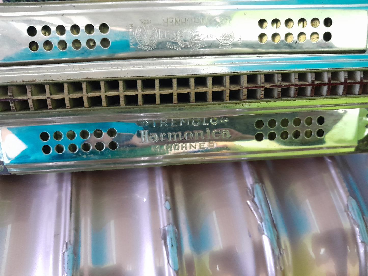 Vintage 4-sided tremolo harmonica by M. Hohner, showcasing unique design and craftsmanship.
