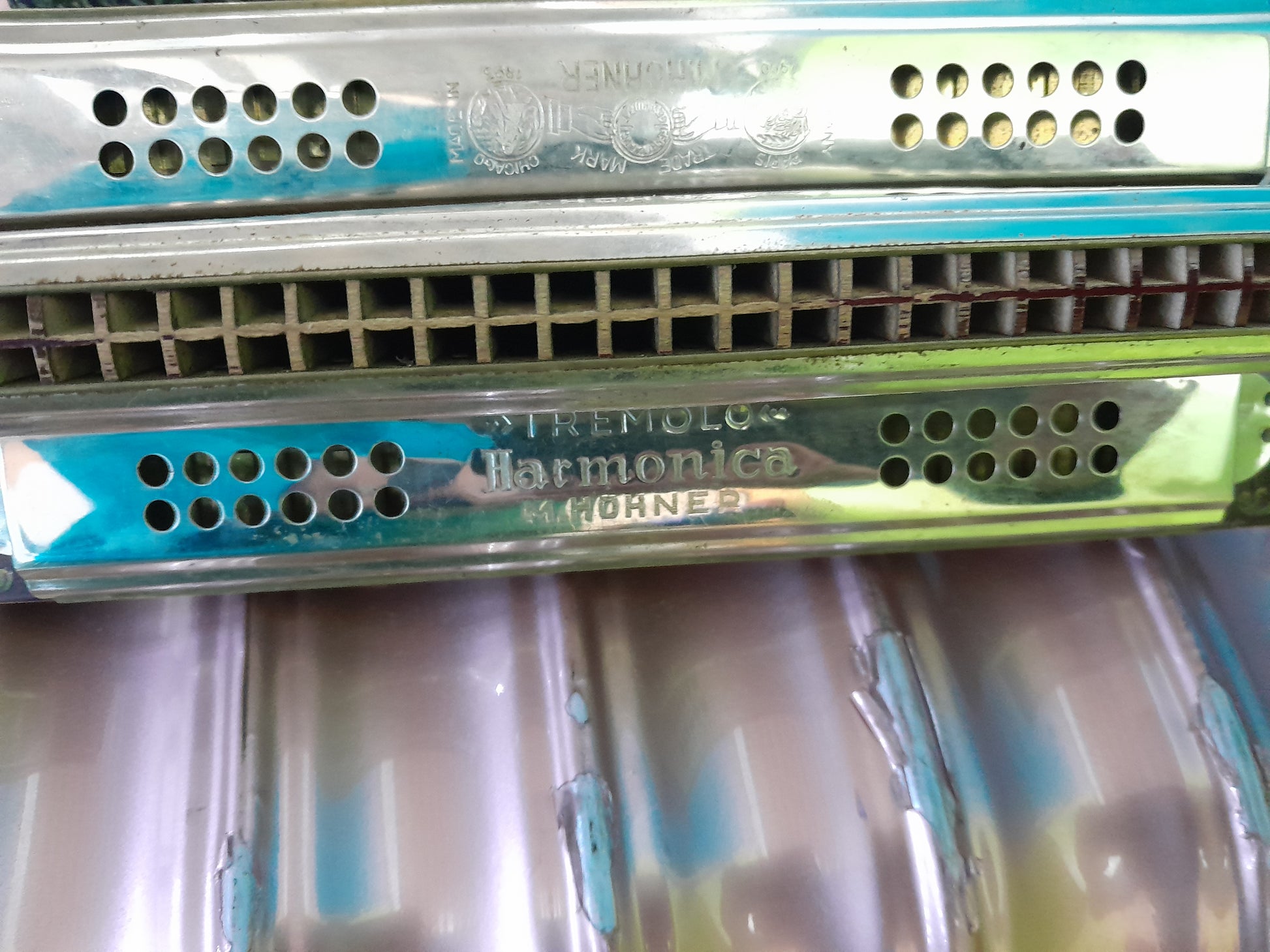 Vintage 4-sided tremolo harmonica by M. Hohner, showcasing unique design and craftsmanship.