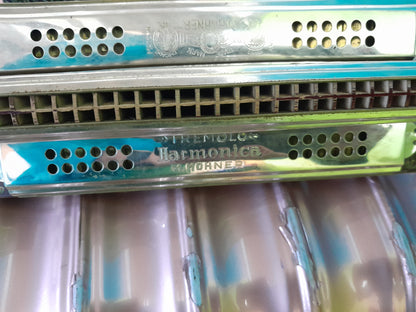 Vintage 4-sided tremolo harmonica by M. Hohner, showcasing unique design and craftsmanship.