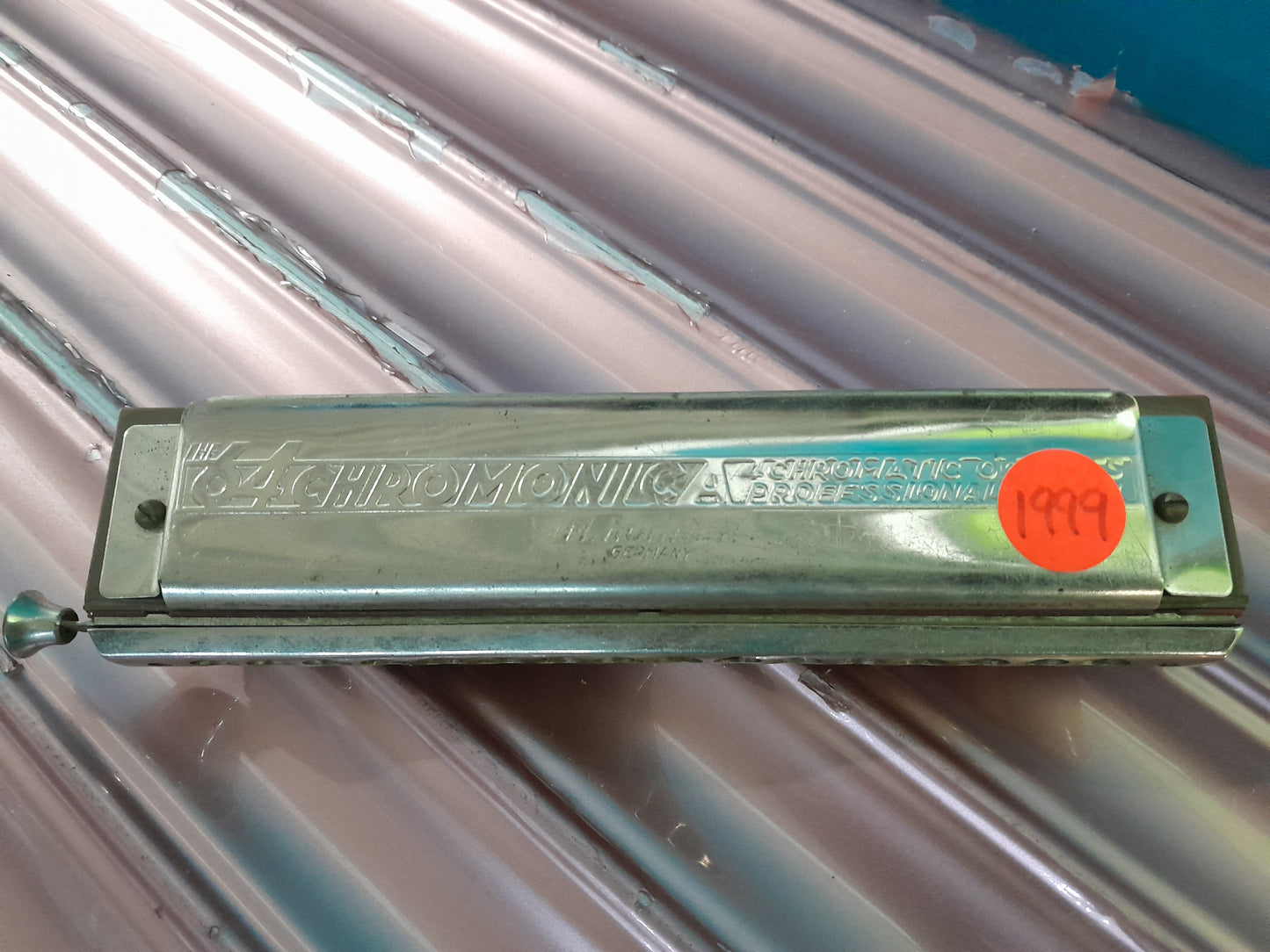 Close-up of Hohner Chromonica 64 harmonica showcasing its intricate design and craftsmanship.