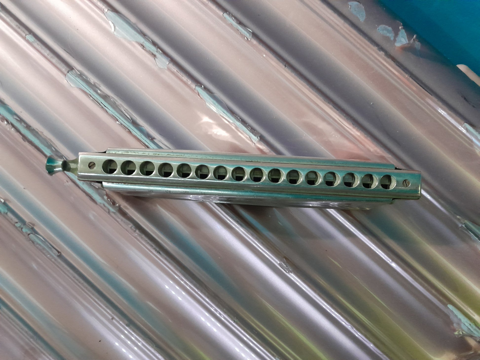 Hohner Chromonica 64 harmonica showing 16 holes and professional design for musicians.