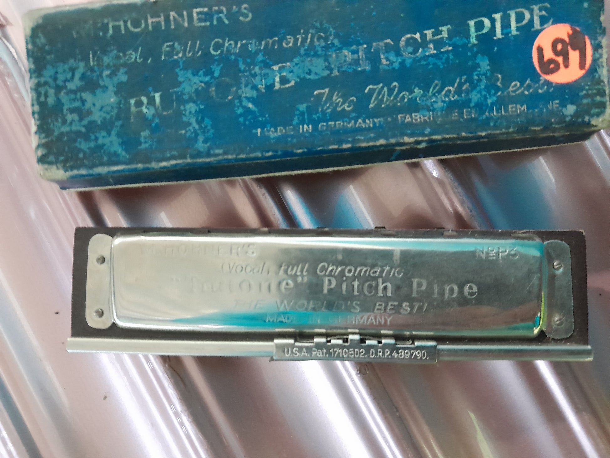 Original packaging of M. Hohner's Trutone Pitch Pipe, a vintage musical instrument for pitch reference.