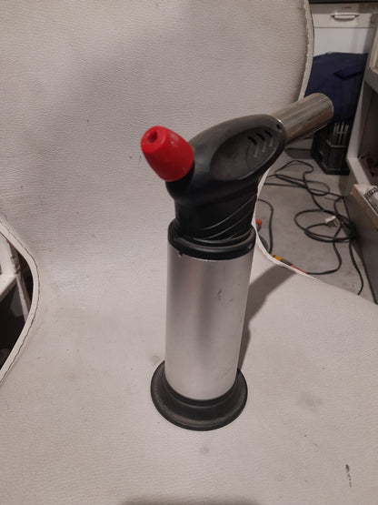 Versatile butane torch, perfect for culinary use and various DIY tasks.