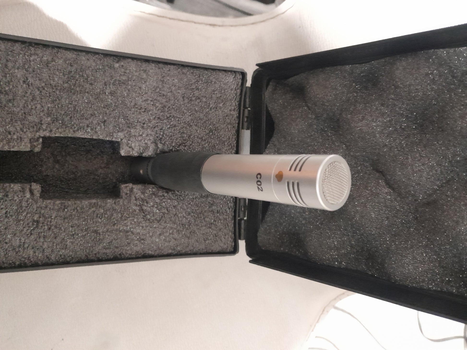 Samson C02 microphone securely placed inside its case, ready for transport and use.